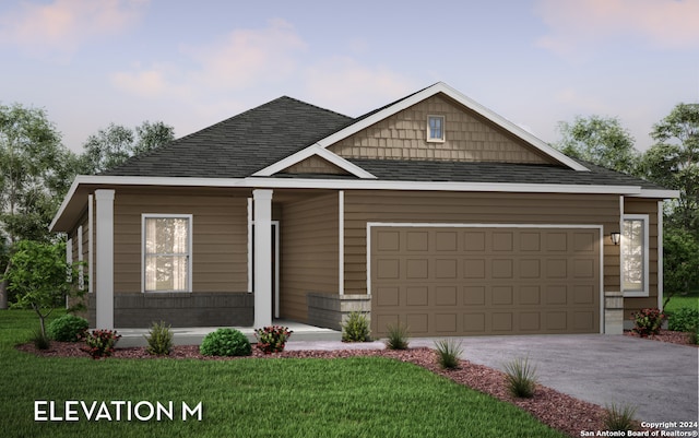 view of front facade with a front yard and a garage