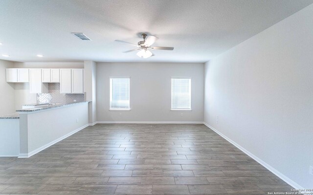 spare room featuring ceiling fan and light tile floors