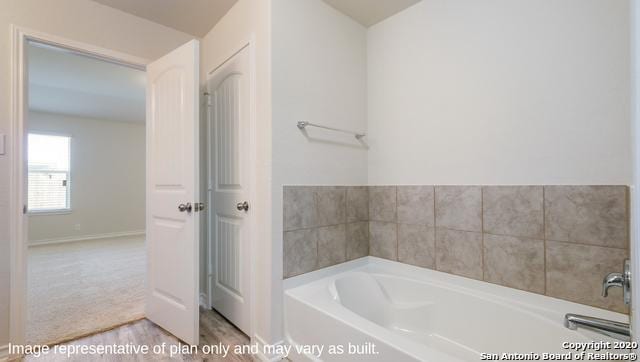 bathroom featuring a tub