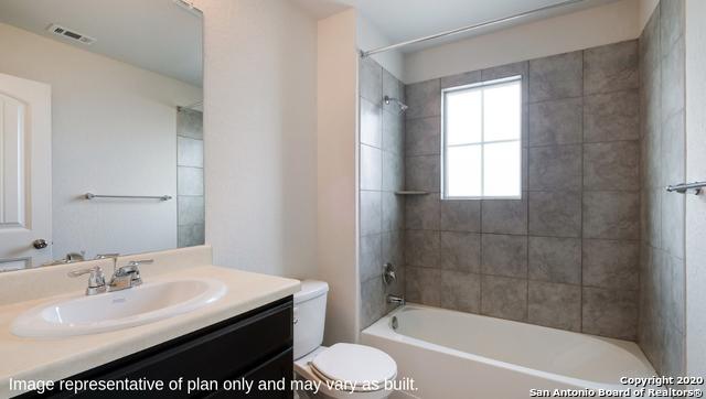 full bathroom featuring vanity, toilet, and tiled shower / bath