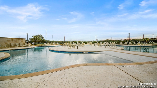 view of swimming pool featuring a patio