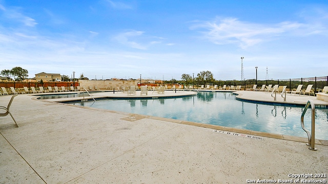 view of pool featuring a patio