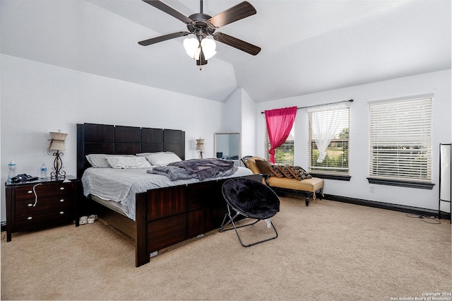 carpeted bedroom featuring vaulted ceiling and ceiling fan