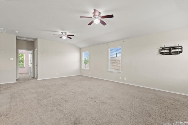 empty room with carpet, ceiling fan, and lofted ceiling