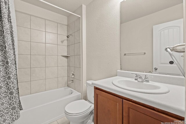 full bathroom featuring vanity, toilet, and shower / tub combo with curtain