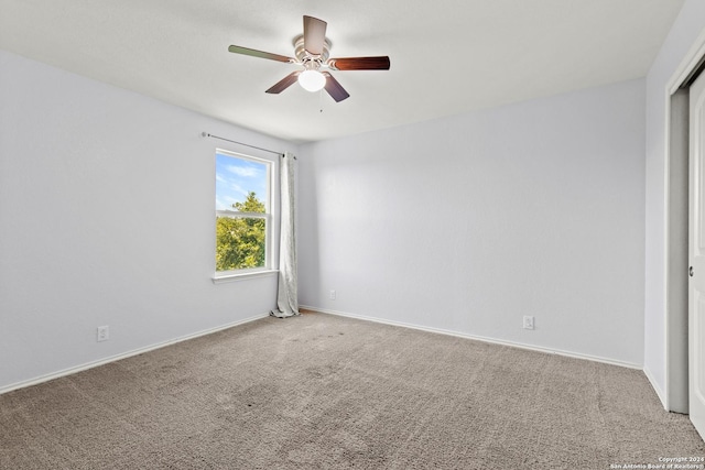 unfurnished room featuring carpet flooring and ceiling fan