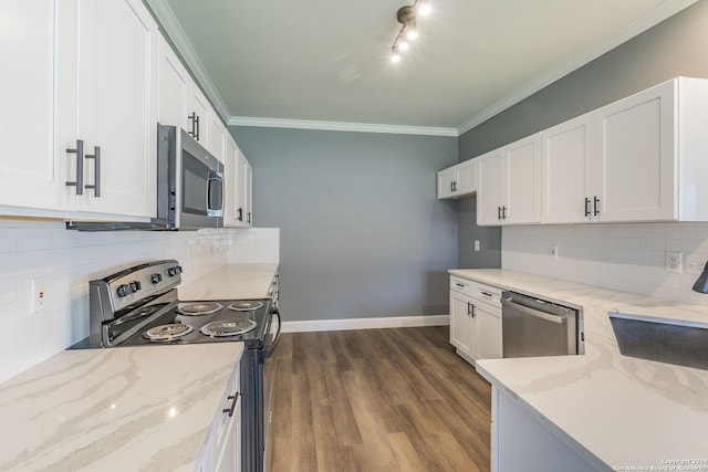 kitchen featuring stainless steel appliances, dark hardwood / wood-style flooring, light stone countertops, ornamental molding, and white cabinets