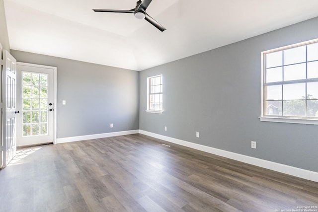 spare room with ceiling fan, plenty of natural light, and lofted ceiling