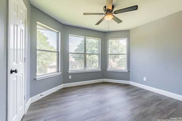 spare room with ceiling fan and hardwood / wood-style floors