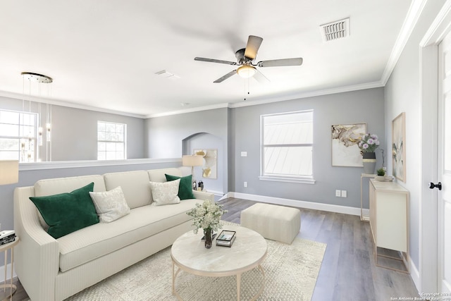 living room with ceiling fan, ornamental molding, and hardwood / wood-style flooring