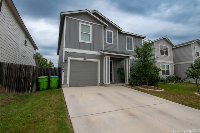 front facade featuring a garage and a front lawn