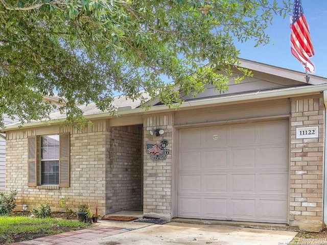 ranch-style home with a garage