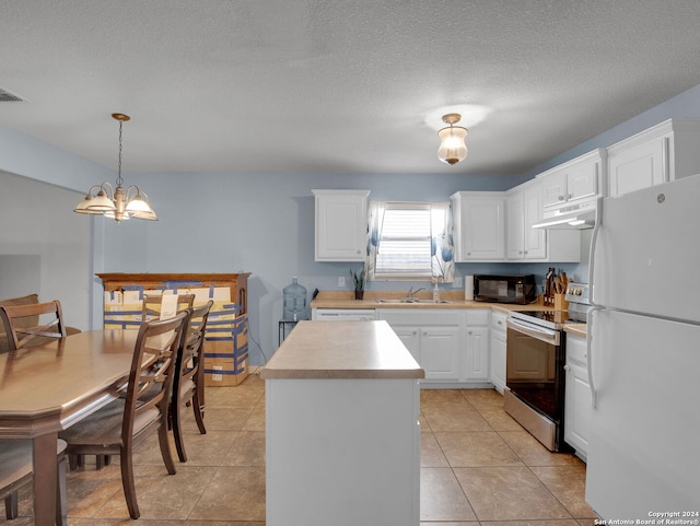 kitchen featuring electric stove, white cabinetry, white fridge, and decorative light fixtures