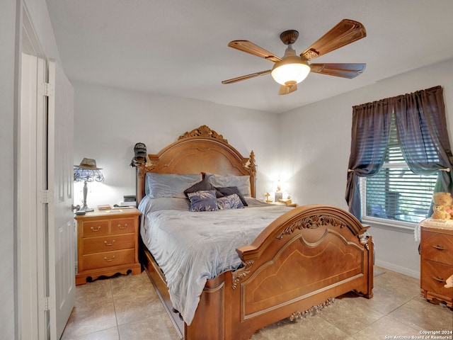 bedroom featuring ceiling fan and light tile patterned flooring