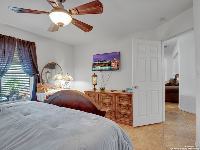 bedroom featuring ceiling fan and light tile patterned flooring