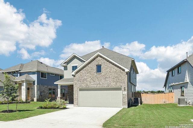 view of front of home featuring a garage and a front yard