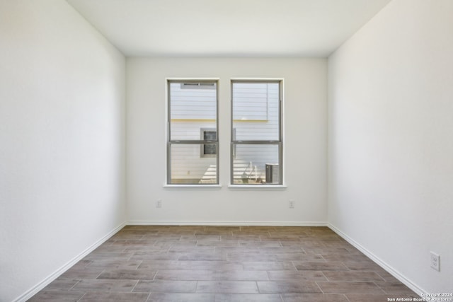 spare room featuring light wood-type flooring