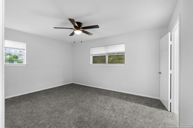 carpeted empty room with ceiling fan