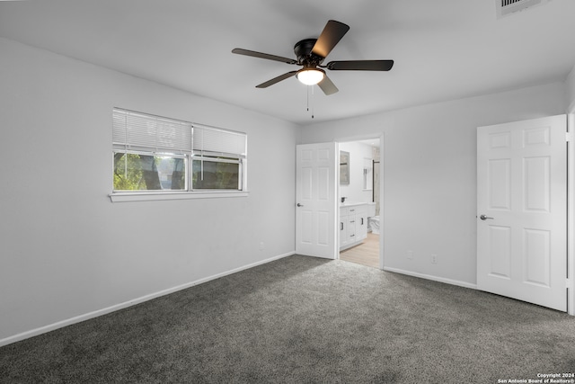 unfurnished bedroom with carpet, ceiling fan, and ensuite bath