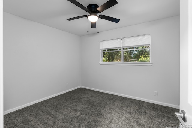 spare room featuring carpet and ceiling fan