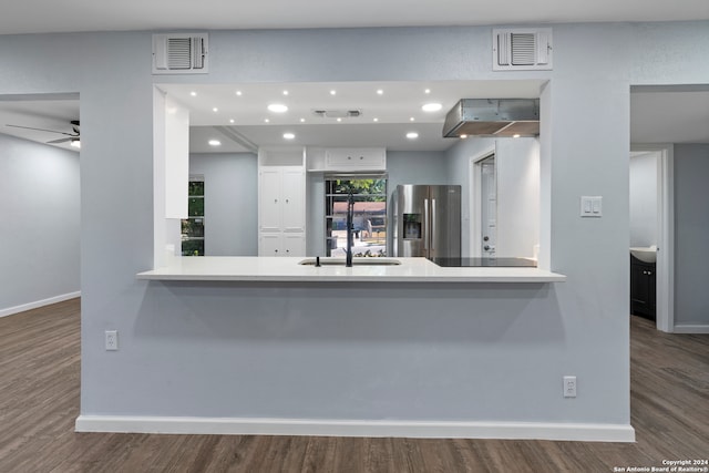 kitchen featuring ceiling fan, stainless steel refrigerator with ice dispenser, dark hardwood / wood-style flooring, sink, and white cabinets