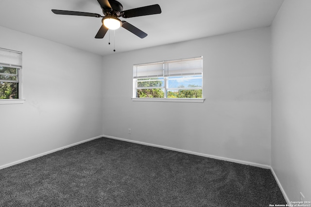 empty room featuring carpet and ceiling fan