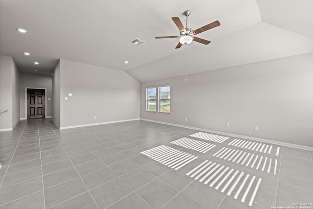 unfurnished living room with ceiling fan, light tile patterned floors, and lofted ceiling