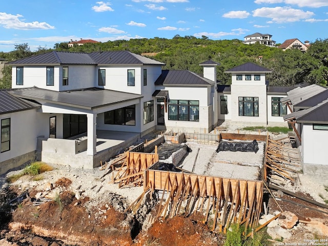 rear view of house with a patio