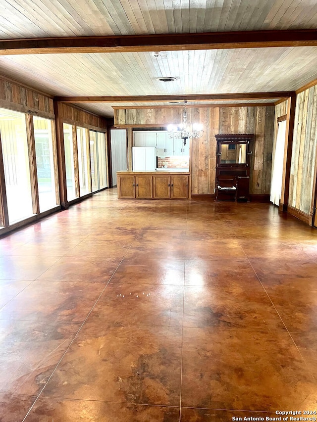 unfurnished living room with beamed ceiling, tile floors, and wooden ceiling