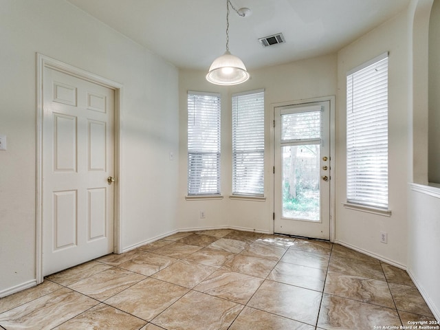 interior space with light tile patterned floors