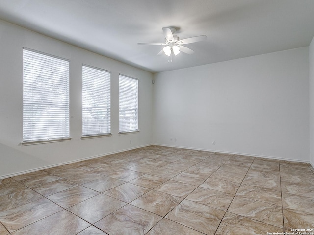 spare room featuring ceiling fan