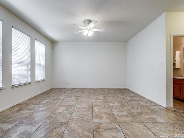 spare room featuring ceiling fan