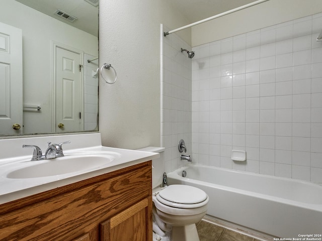 full bathroom with tile patterned floors, vanity, bathtub / shower combination, and toilet