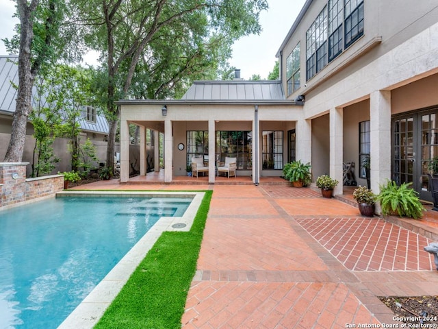 view of swimming pool with a patio area