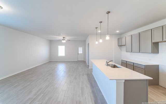 interior space with a healthy amount of sunlight, hardwood / wood-style flooring, and ceiling fan