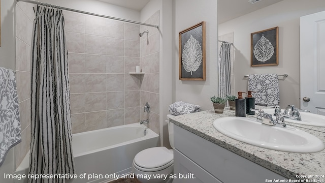 full bathroom featuring toilet, vanity, and shower / bathtub combination with curtain