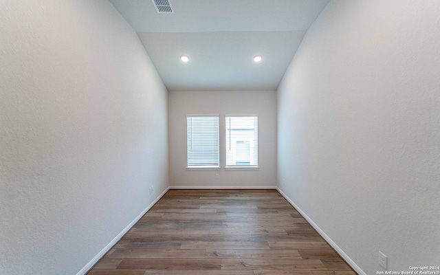 spare room featuring light hardwood / wood-style floors