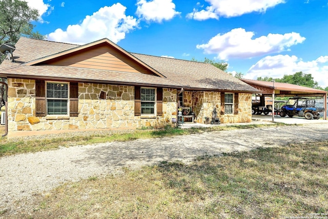 ranch-style house with a carport