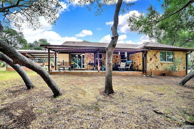 rear view of property with a patio