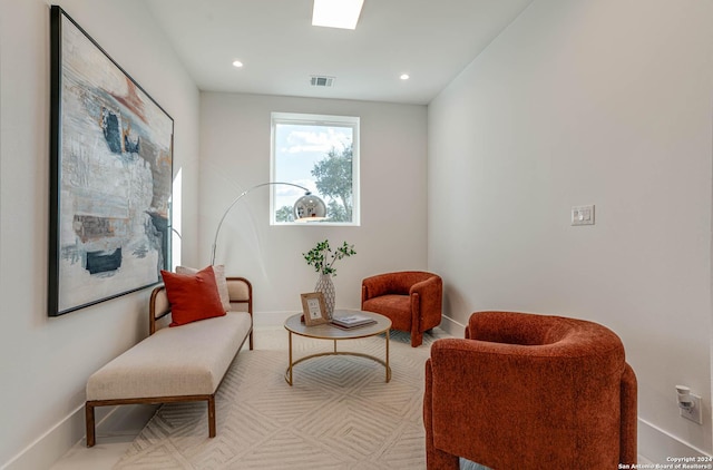 sitting room with recessed lighting, visible vents, and baseboards