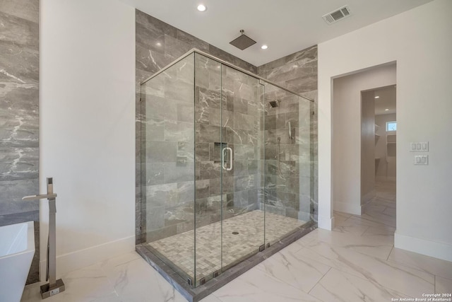 bathroom featuring separate shower and tub and tile floors