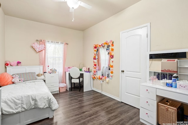 bedroom with dark hardwood / wood-style flooring and ceiling fan