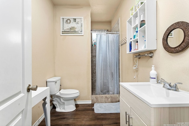 bathroom featuring vanity, hardwood / wood-style floors, toilet, and a shower with shower curtain