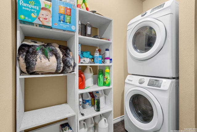 laundry area with stacked washer and clothes dryer