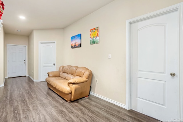 sitting room with hardwood / wood-style flooring