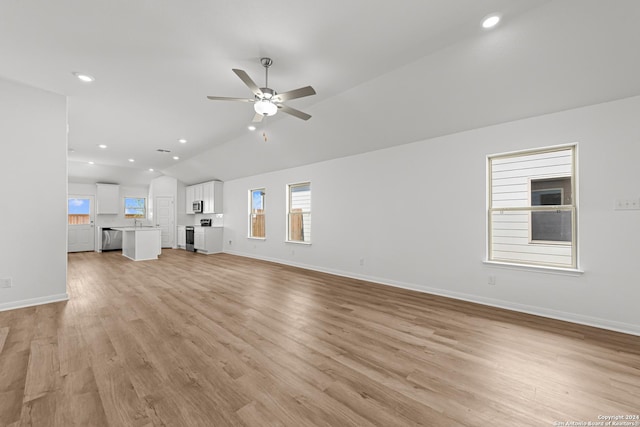 unfurnished living room with light hardwood / wood-style flooring, ceiling fan, and lofted ceiling