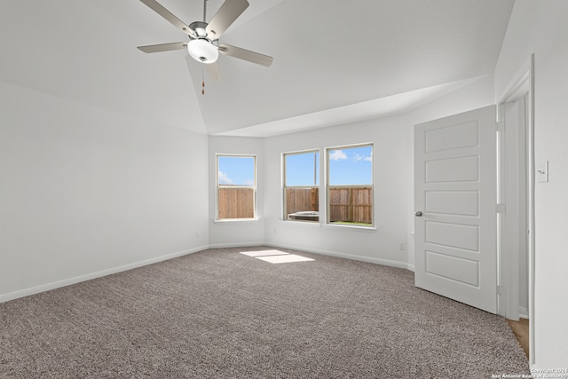 empty room with carpet, ceiling fan, and lofted ceiling