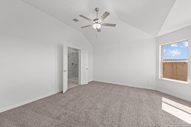 carpeted empty room featuring vaulted ceiling and ceiling fan