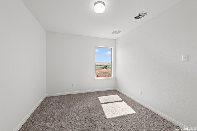 spare room featuring carpet flooring