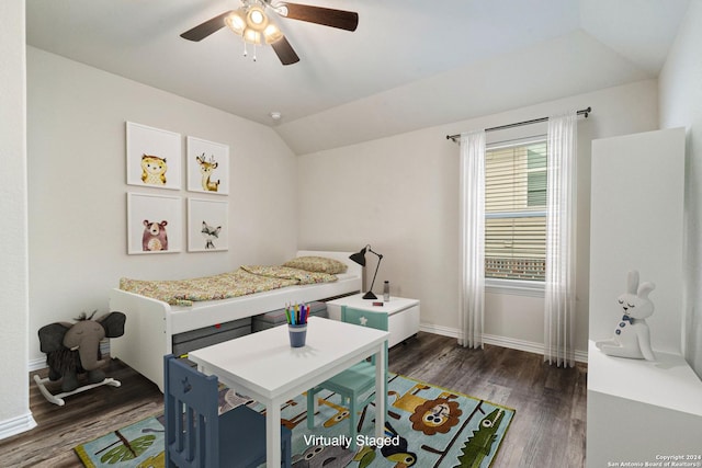 bedroom with vaulted ceiling, ceiling fan, and dark wood-type flooring